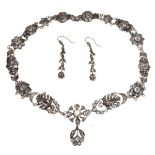 Early 20th Century unmarked white metal paste set necklace and a pair of similar drop earrings