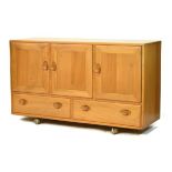 Modern Design - Ercol light elm sideboard, fitted three cupboard doors with two drawers below