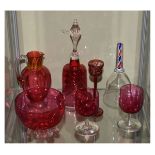 Seven items of glassware to include; five pieces of cranberry glass comprising a pair of goblets,