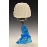 1930's period blue moulded and frosted glass figural table lamp formed as a seated maiden, with a