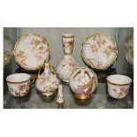 Group of Royal Worcester ivory-ground porcelain comprising a bulbous vase, two handled vase, pot