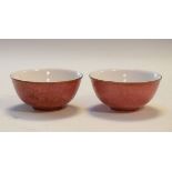 Two 20th Century Chinese porcelain tea bowls, each having incised external scroll decoration and