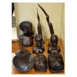 Group of African carved hardwood artefacts to include; figural busts, birds and a decorative scoop