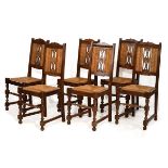 Set of six early 20th Century French oak dining chairs, each having a central carved foliate