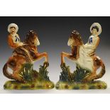 Pair of early 20th Century Staffordshire equestrian figures depicting a lady and gentleman on a