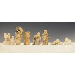 Group of seven Japanese late Meiji period carved ivory netsuke to include; a figure group holding