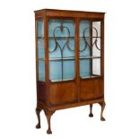 Early 20th Century mahogany and beech display cabinet fitted three shelves enclosed by a pair of
