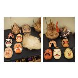 Large selection of Oriental masks, textiles and other effects to include; ten painted carved