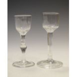 Two antique cordial glasses comprising an example with tapering funnel bowl and bulging knop,