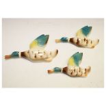 Graduated set of three mid 20th Century English pottery mallard duck wall plaques (3) Condition: