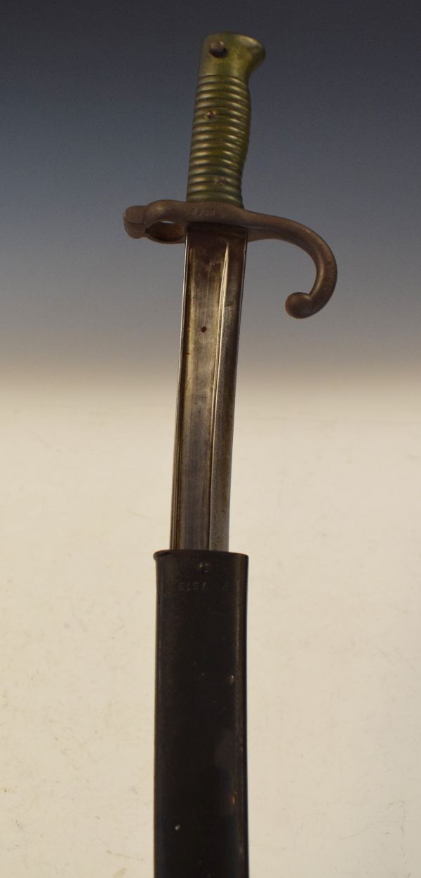 19th Century French bayonet, the sheath stamped 7519, the curved hilt S61491, the 57cm fullered