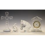 Four items of Waterford crystal comprising: a clock of architectural design, a cross on stepped