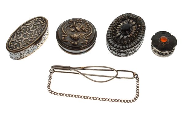 Four assorted silver and white metal patch/pill boxes comprising: two oval and two circular,
