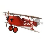 Impressive large scale model petrol-powered bi-plane with wooden propeller, silver-coloured wings