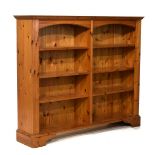 Yellow pine open bookcase having two banks each of three shelves between fluted pilasters Condition: