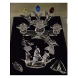 Group of seven Swarovski crystal ornaments to include; a group of three tulips, a triple pricket