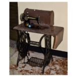 Singer sewing machine on cast iron treadle base Condition: