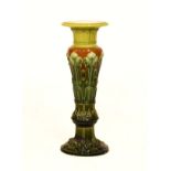 Late 19th Century green and brown glazed majolica jardinière stand decorated with stylised foliage