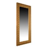 Modern gilt-framed wall or pier mirror with bevelled rectangular plate within fluted surround, 106cm