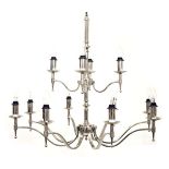 Chromed metal twelve-branch chandelier or ceiling light having four scroll arms above a further