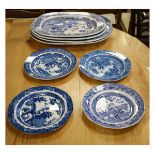 Four 19th Century blue and white transfer printed meat plates decorated with the Willow pattern,