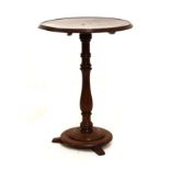 Mahogany tripod occasional table with moulded circular top on spindle stem and disc base with