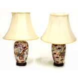 Pair of 20th Century Japanese porcelain table lamps, each of ovoid form with floral decoration on