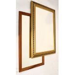 Modern gilt framed wall mirror with bevelled rectangular plate, 105.5cm x 76.5cm, together with a