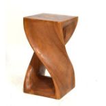Wooden lamp stand of twisted design with square top, carved from a single piece of wood, 50.5cm high