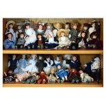 Large collection of assorted miniature dolls in traditional costume, most approximately 15cm high
