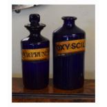 Two 19th Century blue glass apothecary jars, each having an applied paper label Condition: