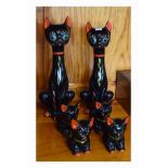 Family of six mid 20th Century Continental pottery cat figurines comprising: two adults and four