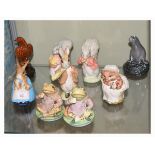 Seven Royal Albert Beatrix Potter figures, together with two Bineagles miniature whisky flasks -