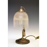 1920's-style table lamp having a tasselled shade on scroll stem and stepped circular base Condition: