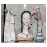 Two Lladro figures - Lady with parasol and Nuns, together with a Lladro bust of a lady Condition: