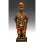 Early 20th Century copper-finish fireside ornament modelled as a Dutch boy, with hooks verso for a