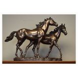 Modern bronze finish composition figure group depicting two horses Condition: