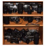 Assorted cameras and zoom lenses to include; Canon TX, Yashica FR, Zenit TTL, zoom lenses to