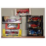 Seven boxed scale model vehicles to include; five by Burago, most 1:18 scale die-cast (7) Condition: