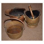 Brass jam pan, together with two coal helmets (3) Condition: