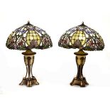 Pair of reproduction Tiffany-style table lamps, each having a mushroom shade over three screw-