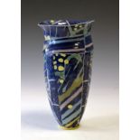 Modern studio pottery vase having abstract decoration on a speckled blue ground Condition: