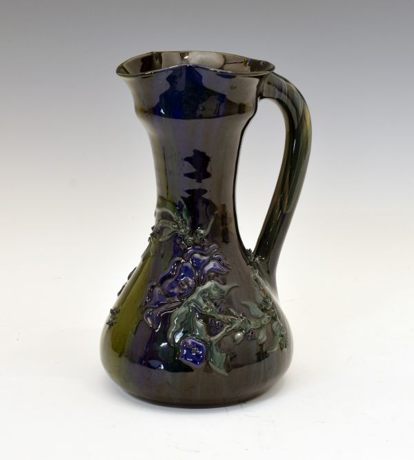 Elton Ware baluster shaped ewer having typical stylised foliate decoration on a blue/green ground,