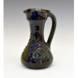 Elton Ware baluster shaped ewer having typical stylised foliate decoration on a blue/green ground,