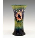 Mid 20th Century Moorcroft vase decorated with an anemone pattern on a green and blue mottled