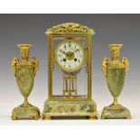 Early 20th Century green onyx four-glass mantel clock, the cream Arabic dial with floral swags