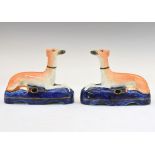 Pair of 19th Century Staffordshire pottery pen stands, each formed as a recumbent greyhound, 12cm