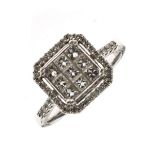 Diamond cluster ring, the white mount stamped '18k 750', the centre set with a square of nine