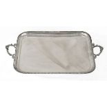 George V silver rectangular two handled tray having a gadrooned edge, the cast handles with