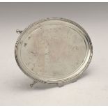 George III silver oval teapot stand having a reeded edge and standing on four splayed feet, sponsors